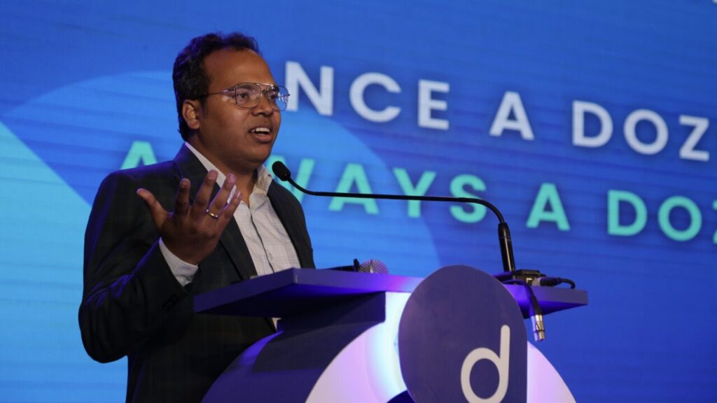 Founder of an Indian Startup speaking on microphone
