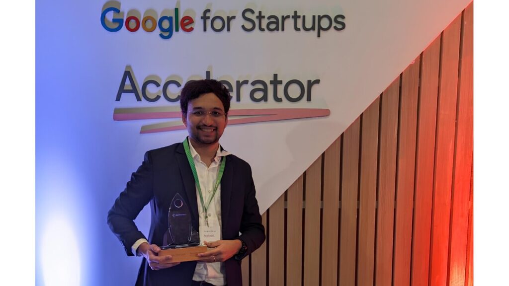 Founder of Endimension Technology holding an award