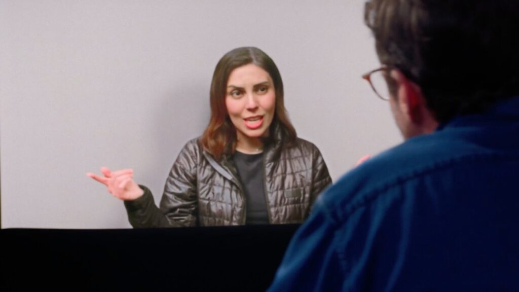Woman talks expressively during a video conversation